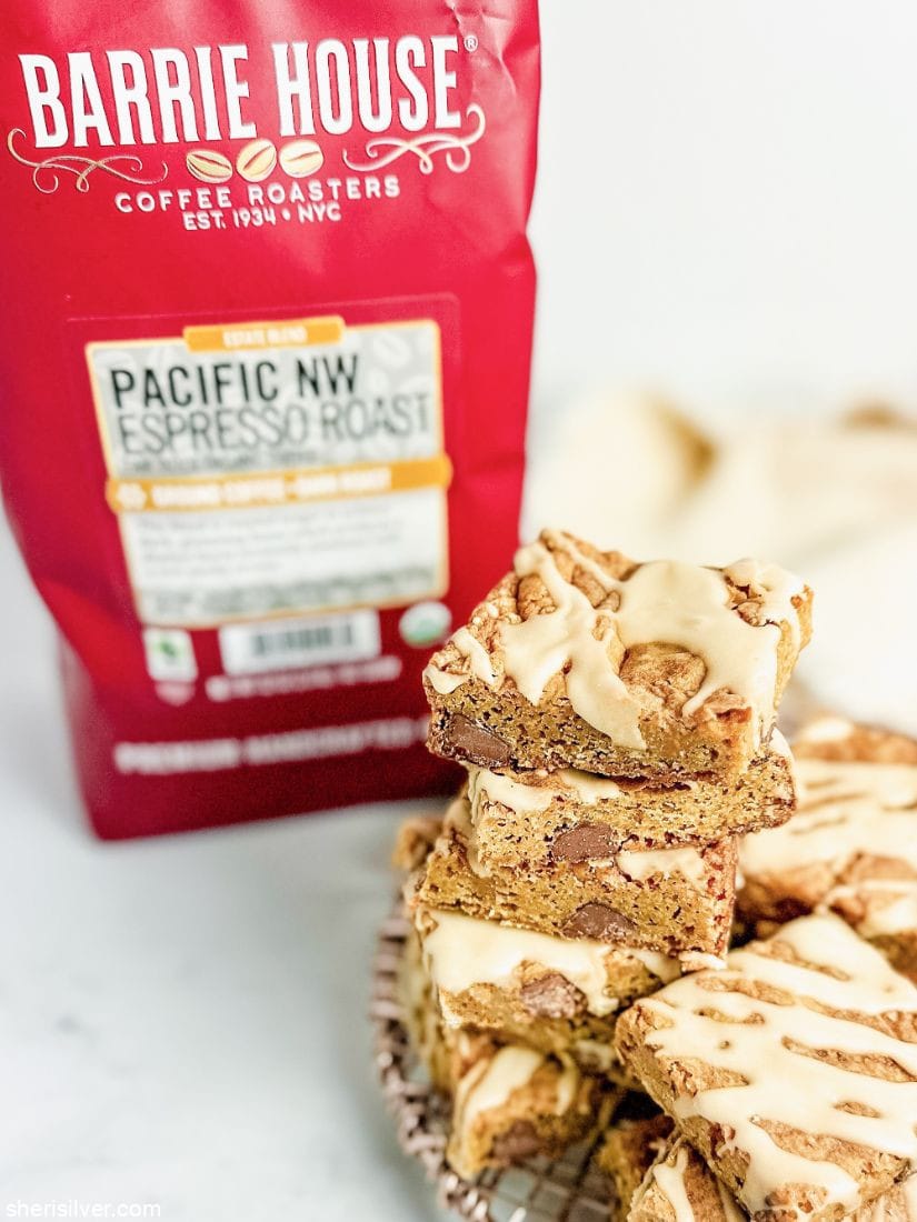 mocha chip blondies with coffee glaze next to a bag of coffee