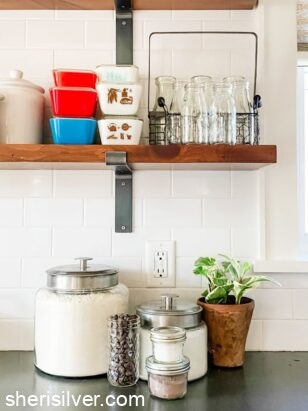 kitchen shelves with jars and dishes