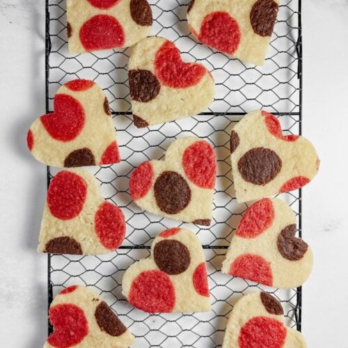 polka dot heart cookies on a wire rack