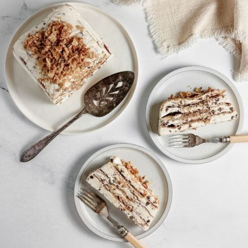cannoli icebox cake slices on white plates with bakelite forks