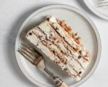cannoli icebox cake slice on a white plate with a bakelite fork