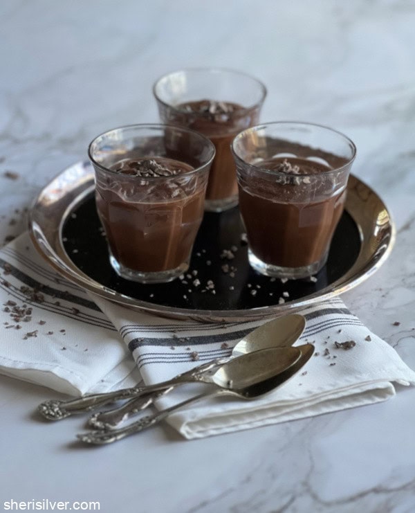mocha chocolate pudding in glasses on a silver tray