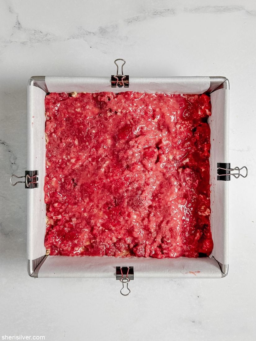 Raspberry layer for raspberry oat squares in a square baking pan