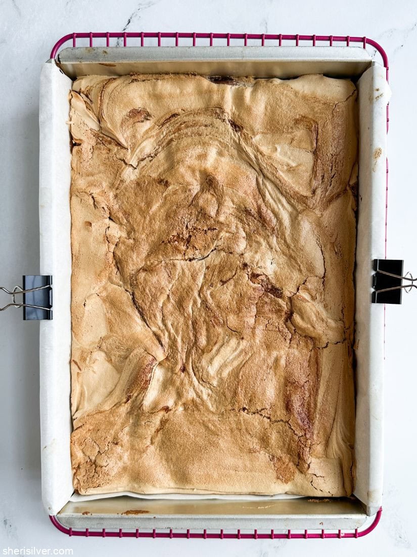 Cranberry curd mud hen bars in a metal baking pan