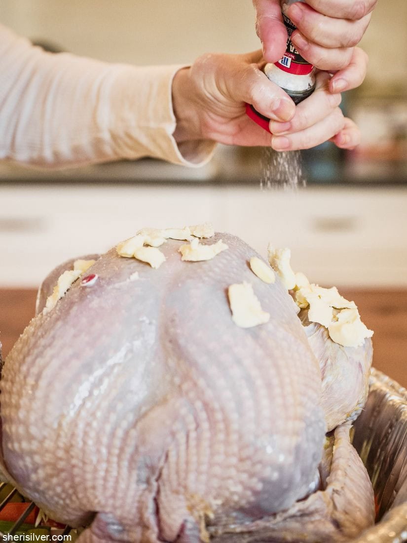 Thanksgiving turkey covered with butter salt and pepper