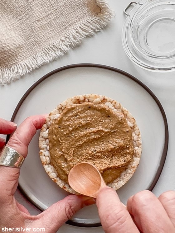 granola butter on a rice cake