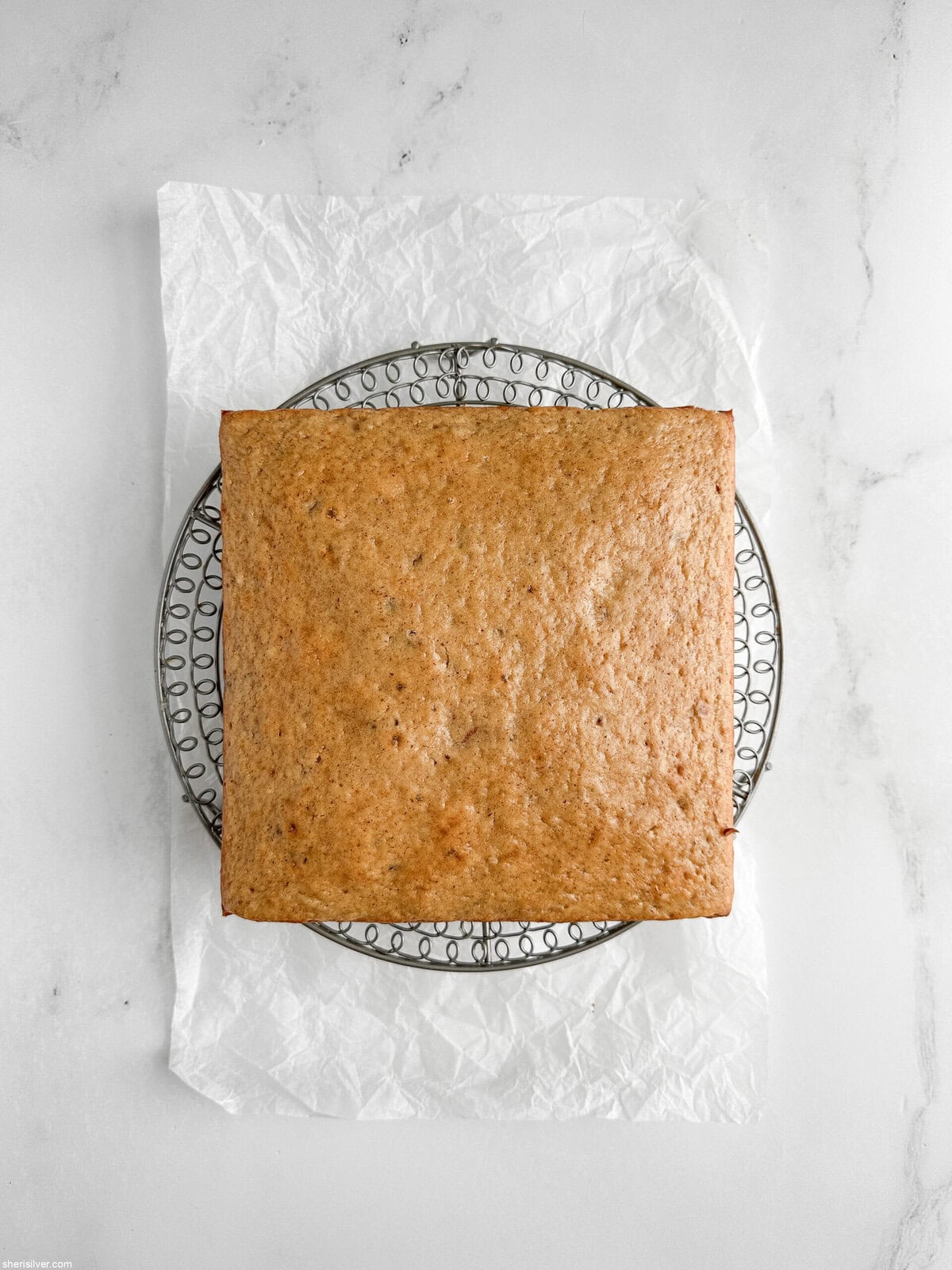 lemon ginger snacking cake with maple glaze on a cooling rack