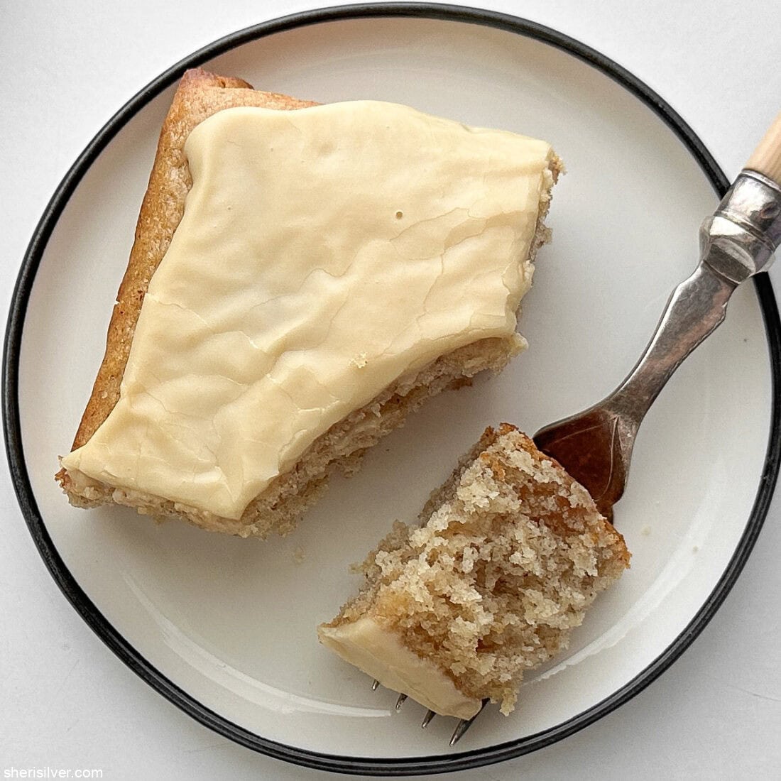 lemon ginger snacking cake with maple glaze on a white plate