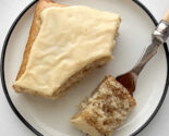 lemon ginger snacking cake with maple glaze on a white plate