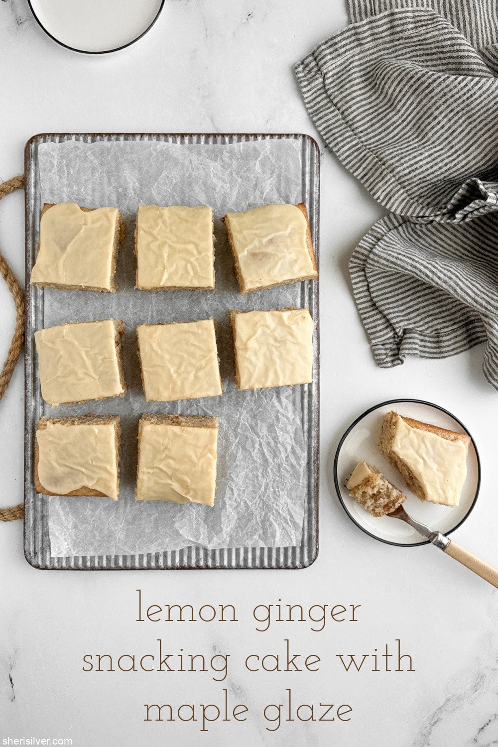 emon ginger snacking cake with maple glaze on a ribbed metal board