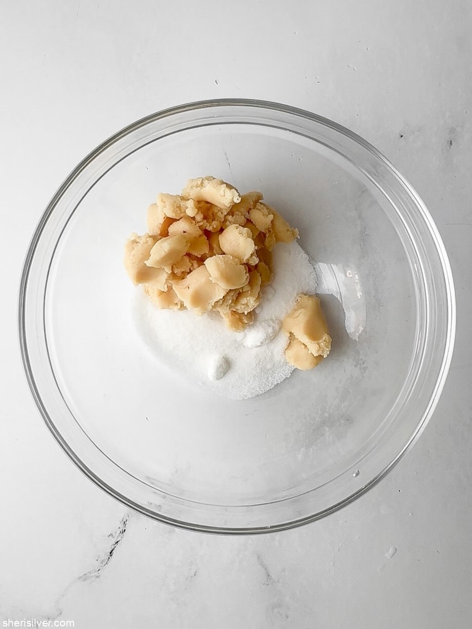 almond paste and sugar for apricot almond bars in a glass bowl