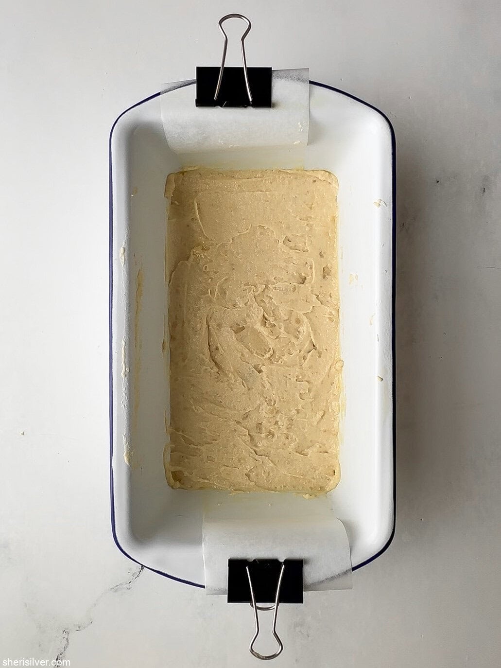 unbaked apricot almond bars in an enamel loaf pan