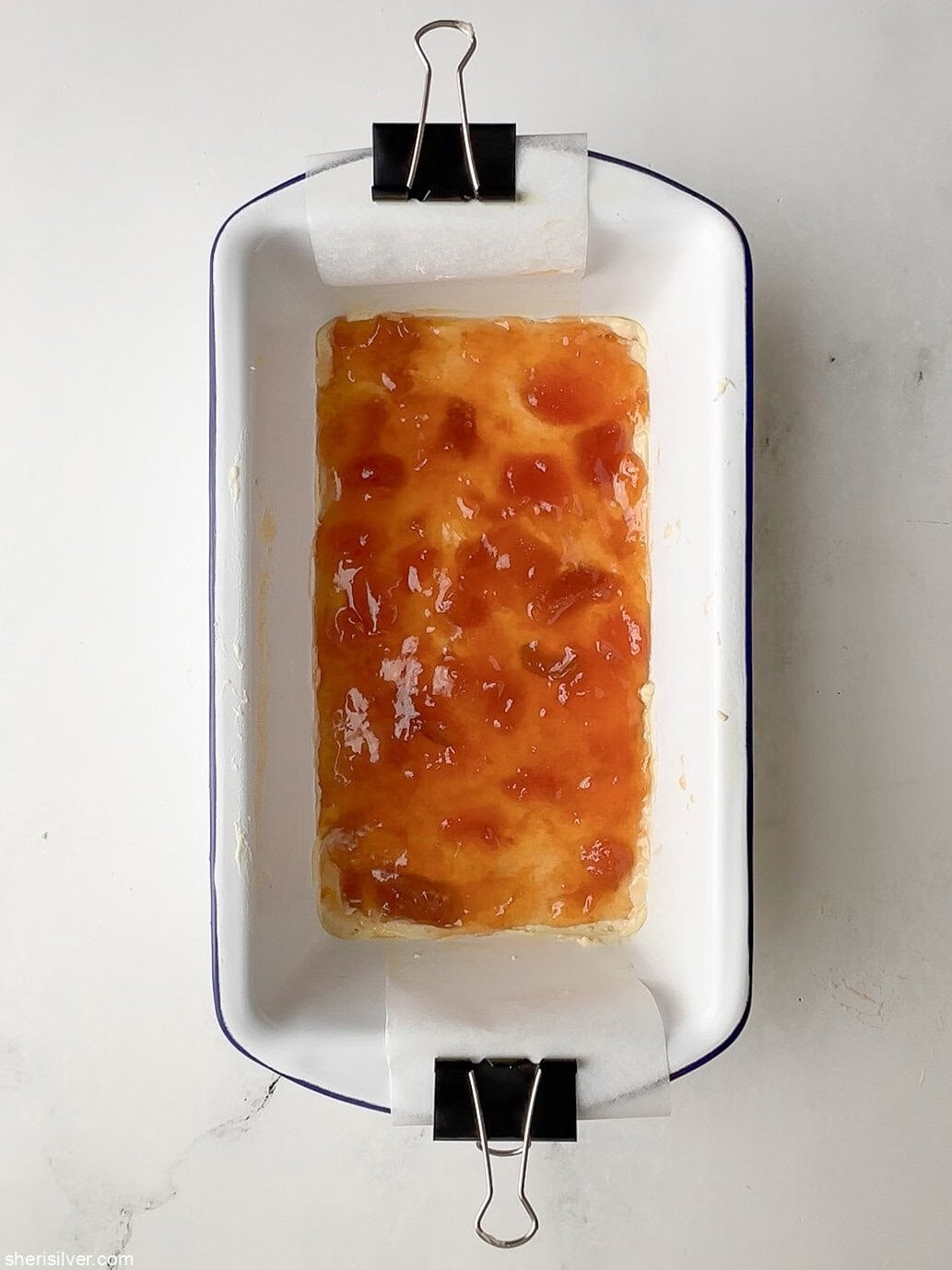 unbaked apricot almond bars in an enamel loaf pan