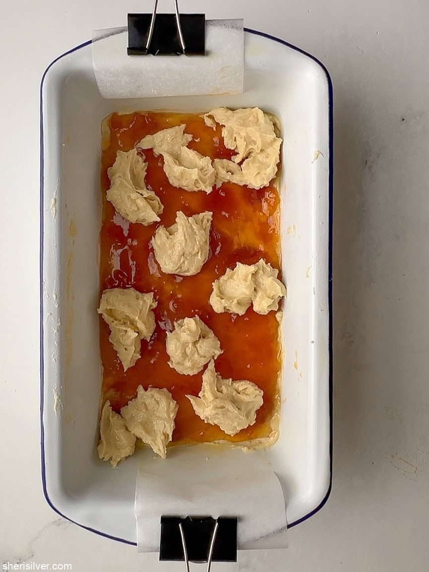 unbaked apricot almond bars in an enamel loaf pan