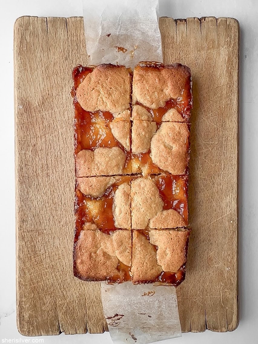apricot almond bars on a wooden board