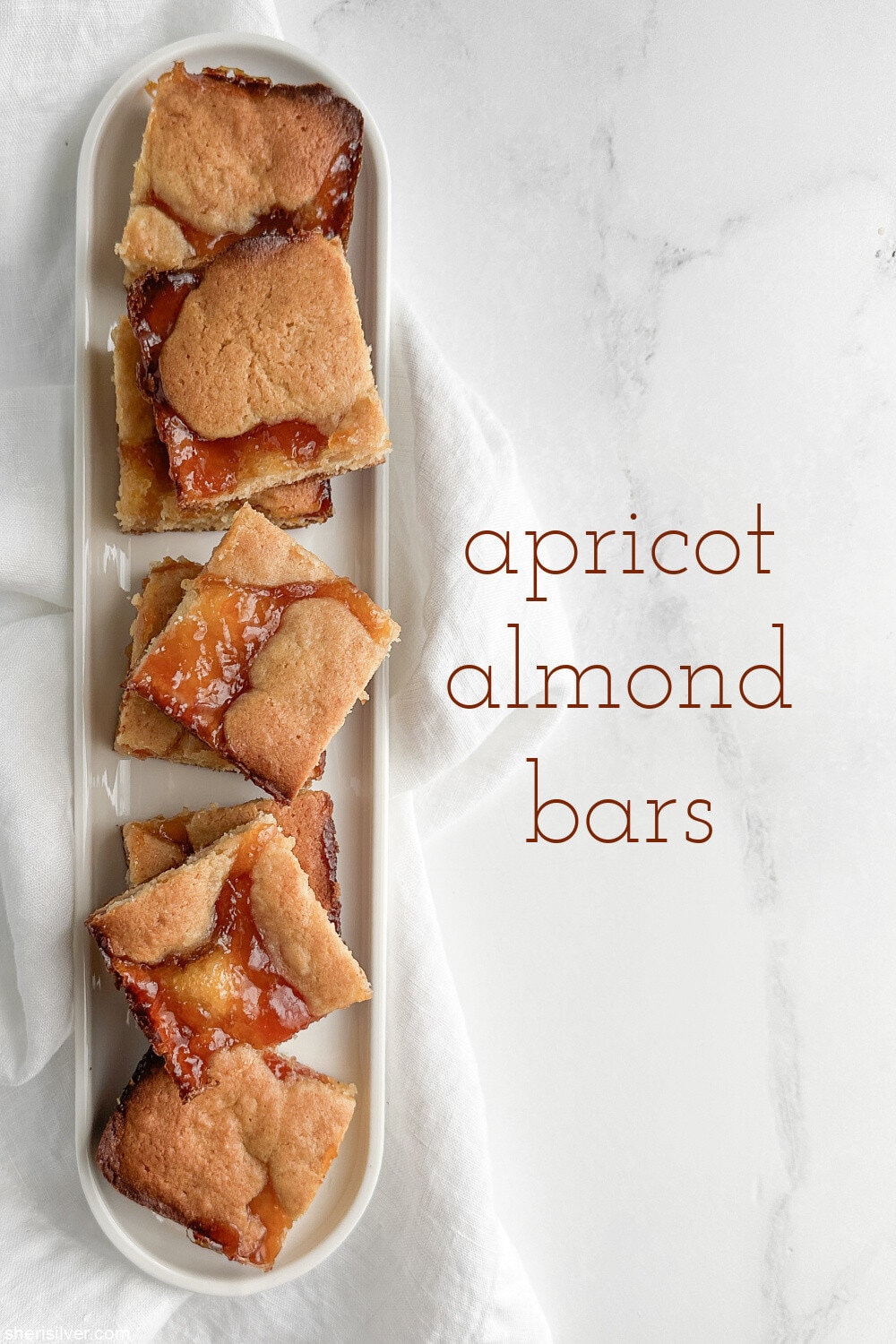 apricot almond bars on a white tray