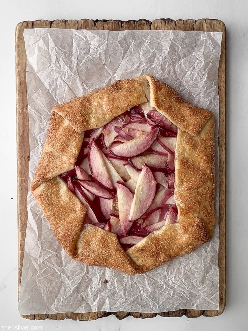 easy peach galette on a wooden board