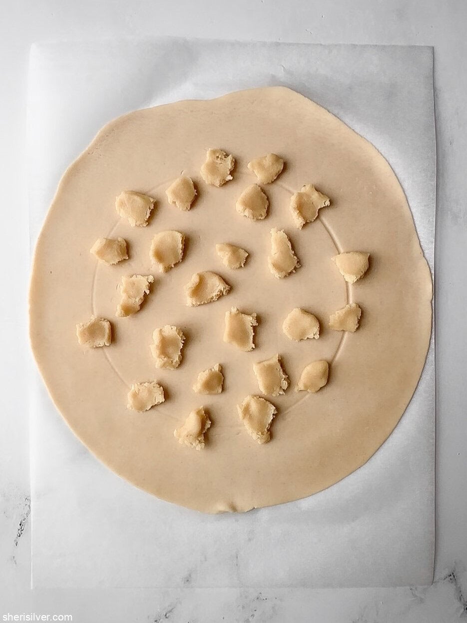 almond pasted on pie dough for easy peach galette