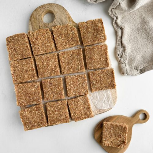 no bake tahini oat bars on a wooden board