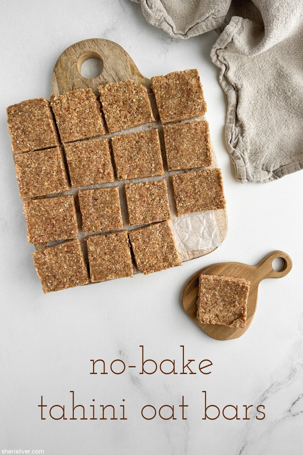 no bake tahini oat bars on a wooden board