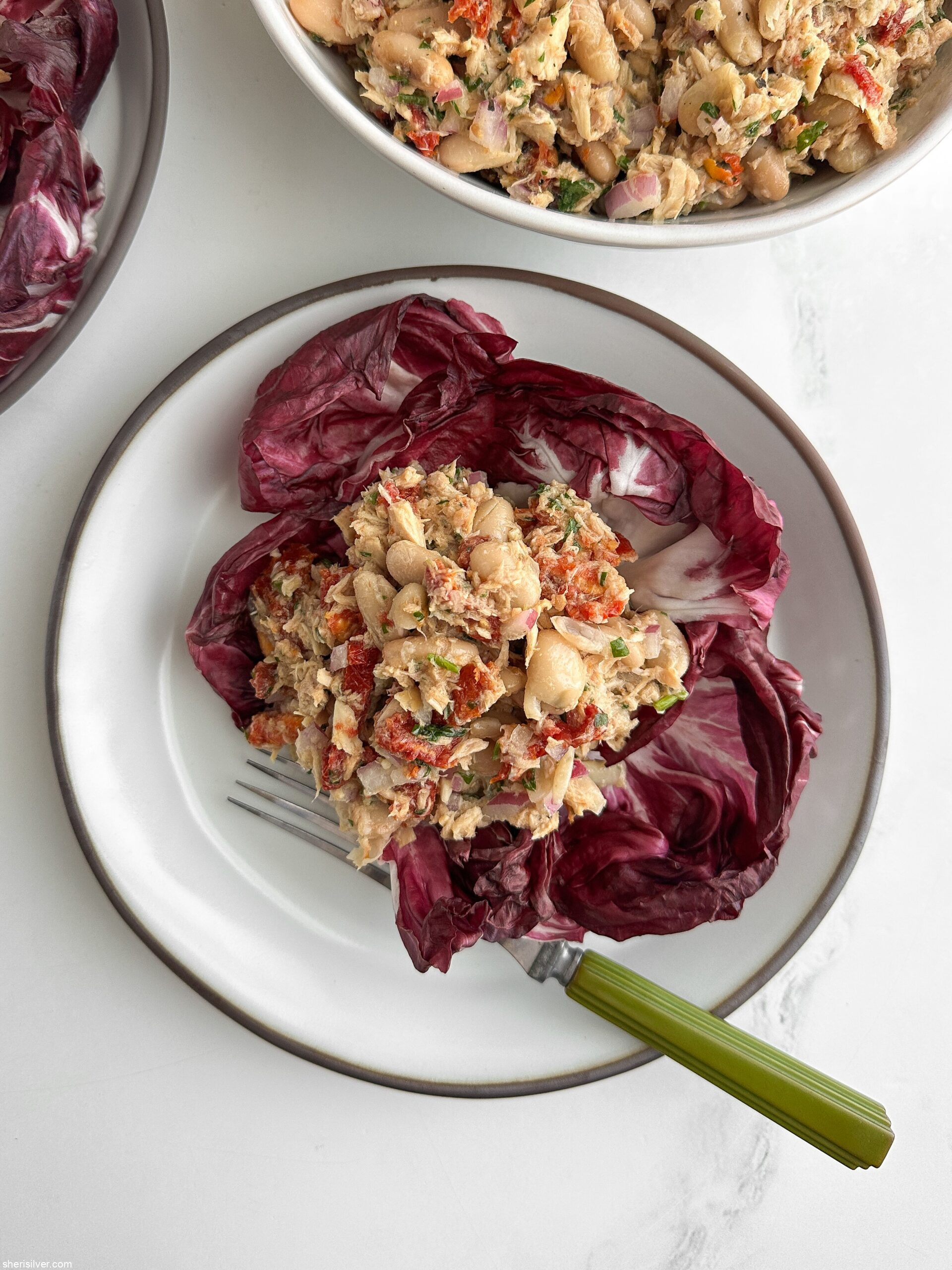 Mediterranean tuna and white bean salad on ceramic plates