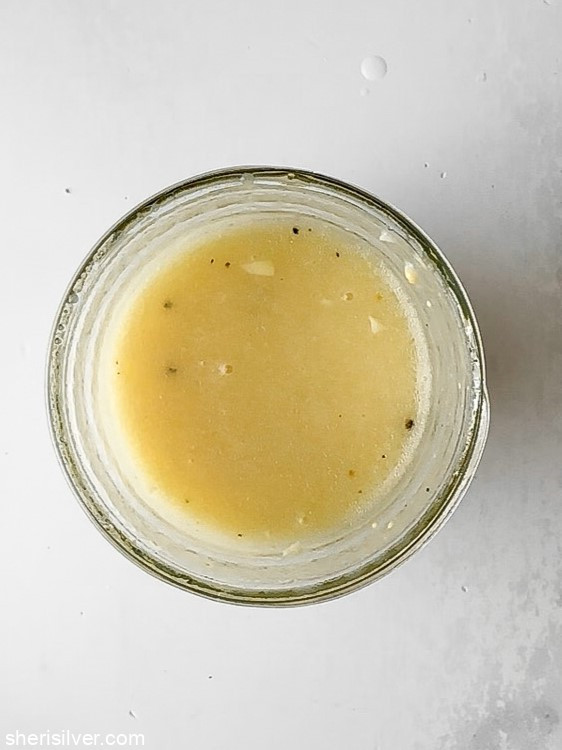 dressing for Mediterranean tuna and white bean salad in a mason jar