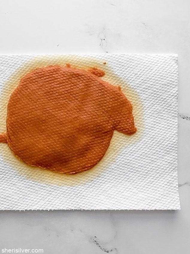 Pumpkin puree spread on layered paper towels to remove excess moisture before baking cookies.