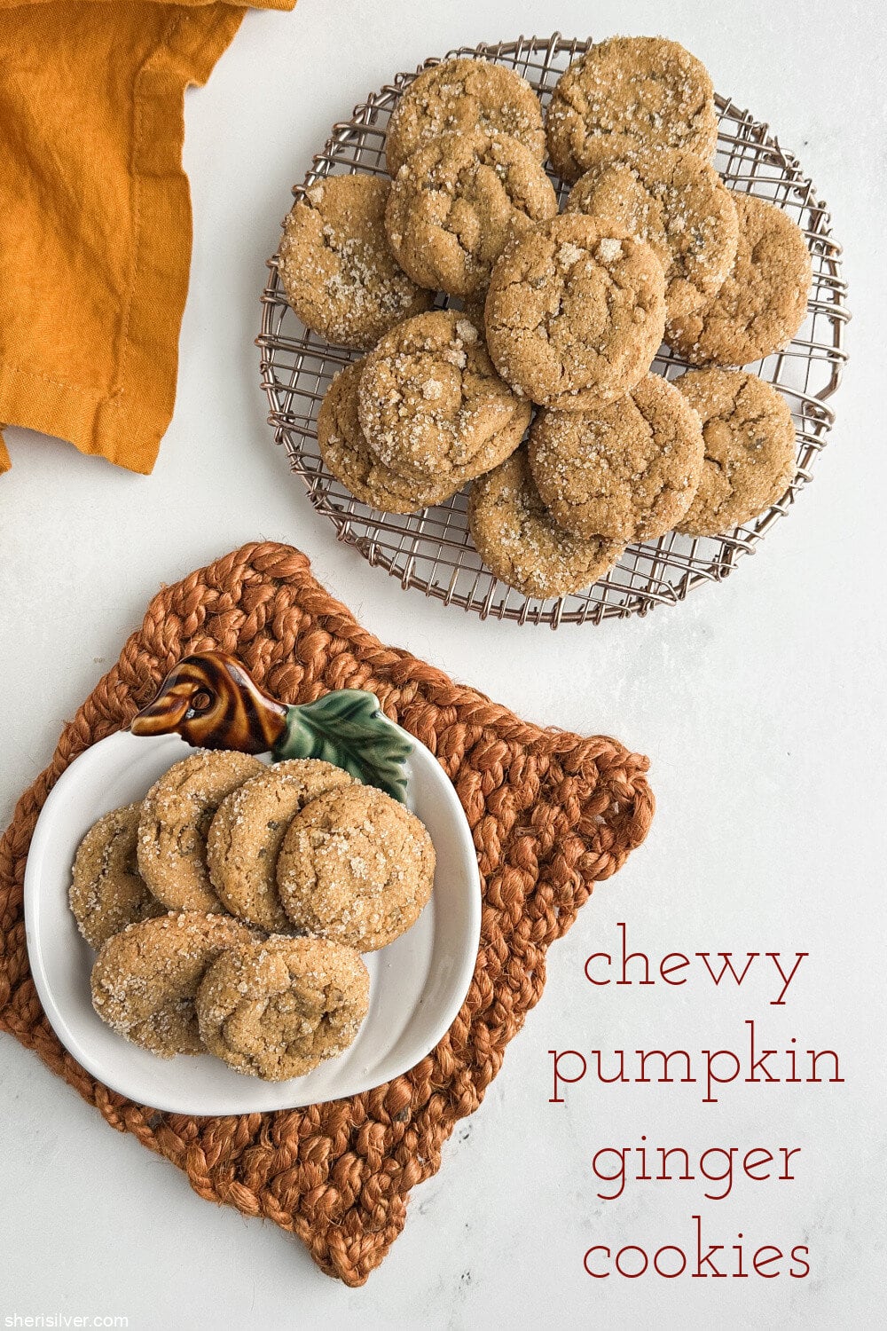 Chewy pumpkin cookies with candied ginger served on a rack and a pumpkin-shaped plate with fall table decor