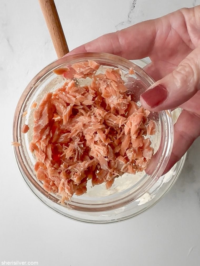 Small glass bowl with flaked Fishwife smoked salmon.